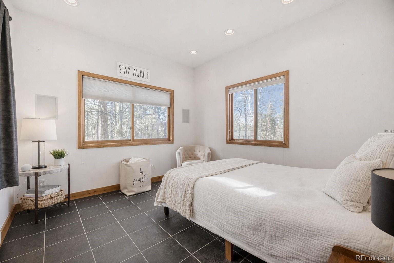 26196 Rea Avenue Conifer, CO 80433 - Photo 9 of 46 a bedroom with a bed and a window