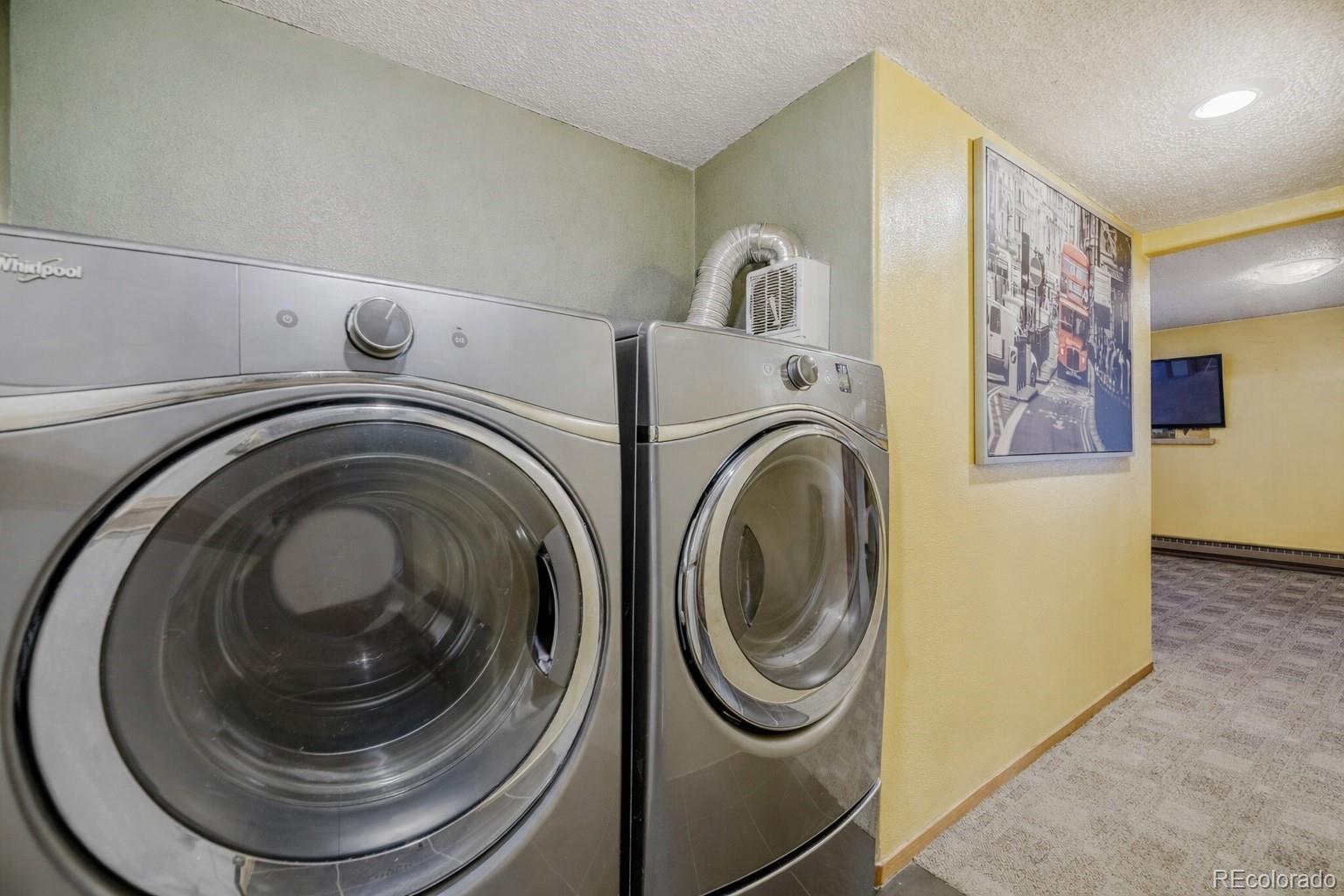 26196 Rea Avenue Conifer, CO 80433 - Photo 10 of 46 a utility room with dryer and washer