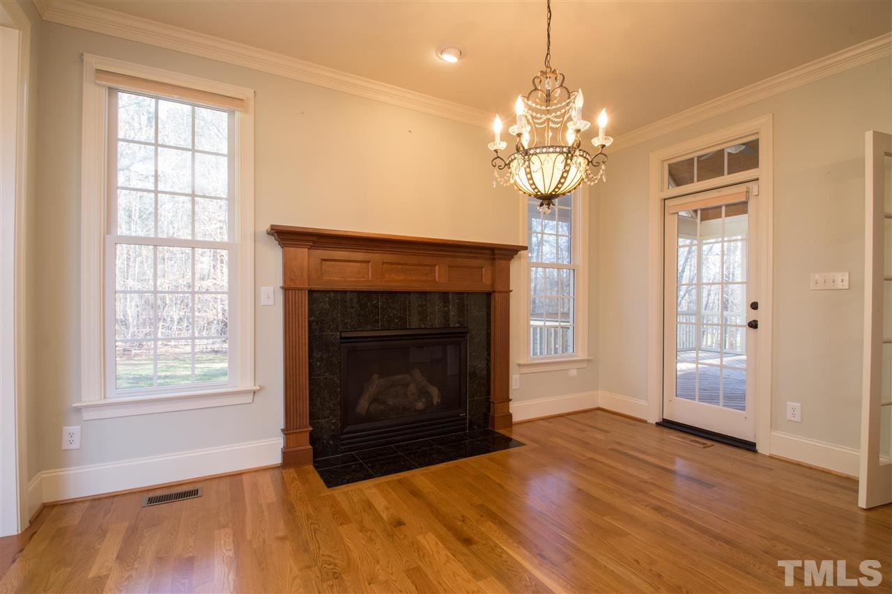 1068 Tacketts Pond Drive Raleigh, NC 27614 - Photo 16 of 25 Amazing gourmet kitchen with large center island, granite counters, stainless steel appliances, tons of cabinet and counter space. Also enjoy the perfect breakfast area with fireplace and cozy keeping room Breakfast Area