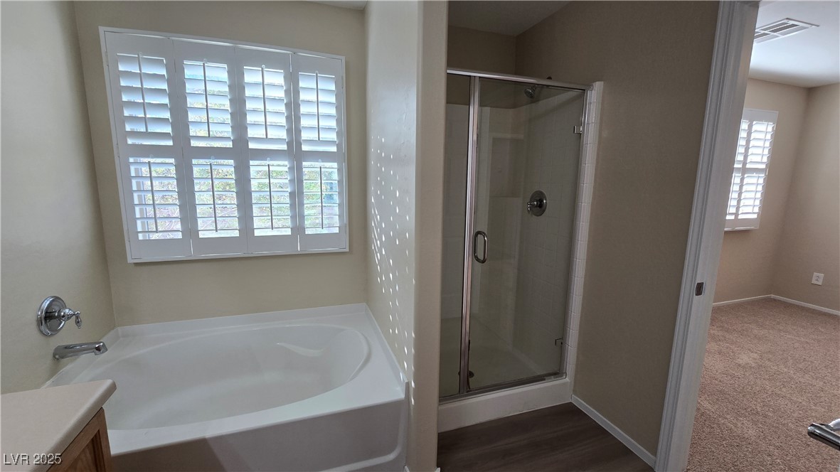 2737 Rimbaud Street Henderson, NV 89044 - Photo 45 of 49 Full bathroom featuring a garden tub, a shower stall, and visible vents