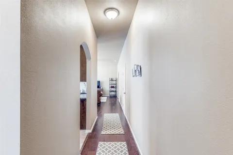 a view of a hallway with a room