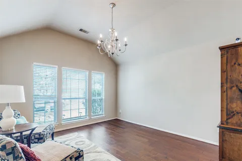 a view of a livingroom with furniture window and wooden floor
