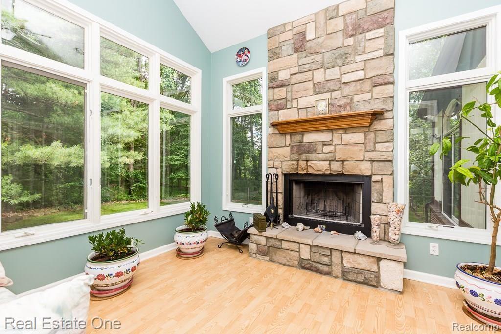 3815 Orion Road Oakland, MI 48363 - Photo 12 of 36 Cozy up to the home's SECOND Natural Fireplace with Beautiful Stone.
