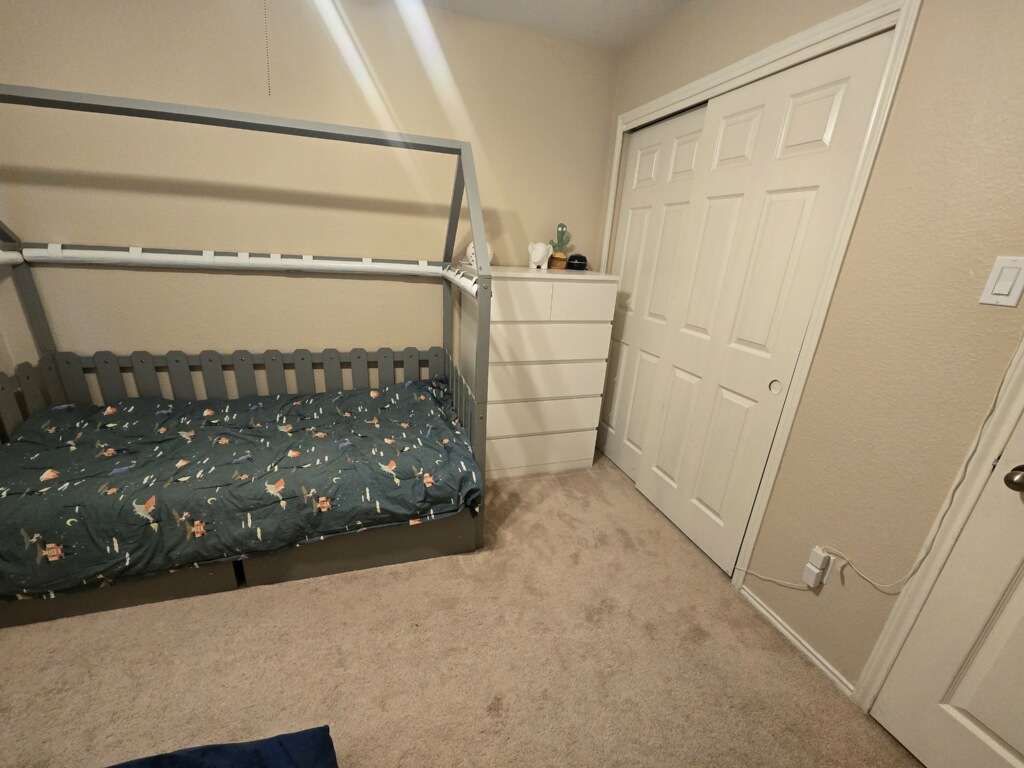 14013 Rountree Ranch Lane Austin, TX 78717 - Photo 15 of 19 Bedroom featuring light colored carpet and a closet