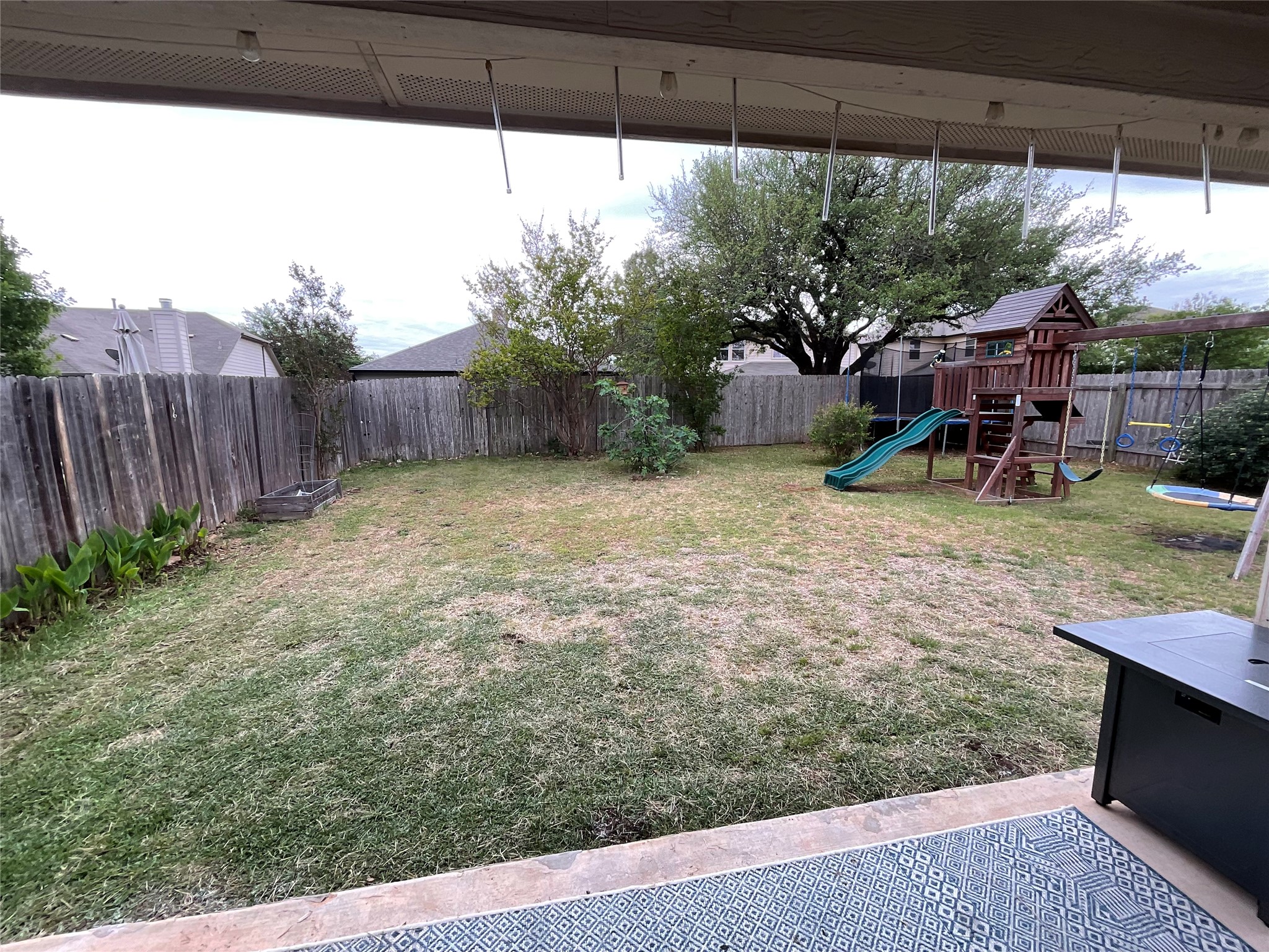 14013 Rountree Ranch Lane Austin, TX 78717 - Photo 19 of 19 Fenced backyard featuring a playground