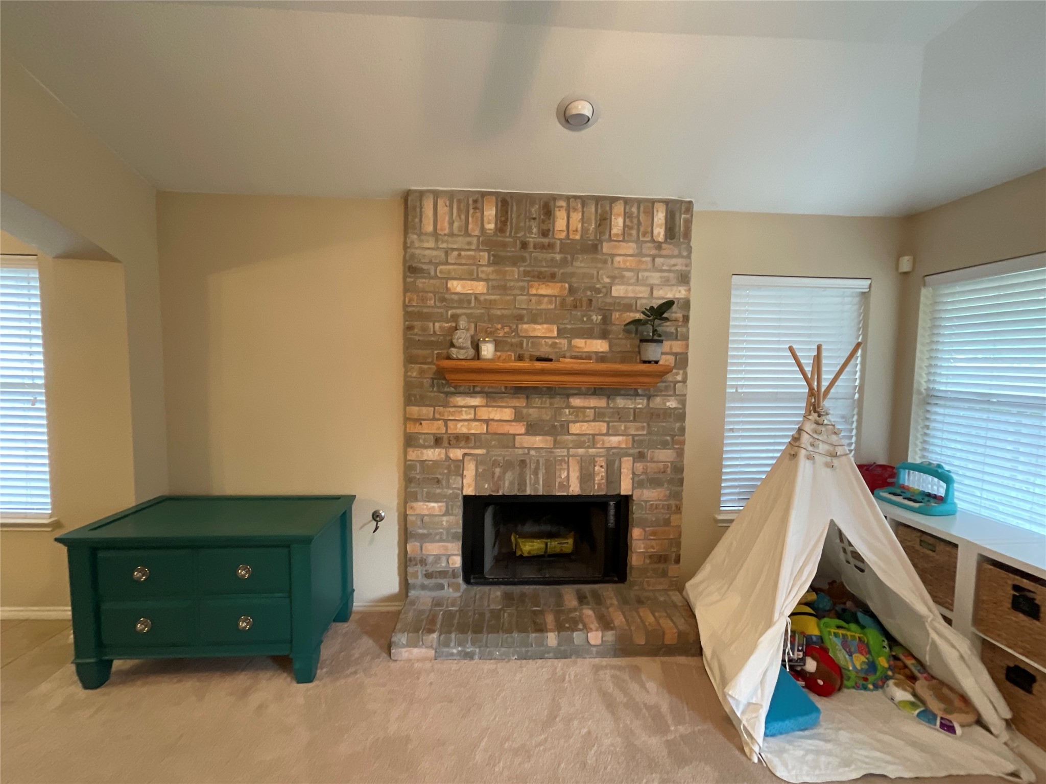 14013 Rountree Ranch Lane Austin, TX 78717 - Photo 6 of 19 Carpeted living area featuring a fireplace