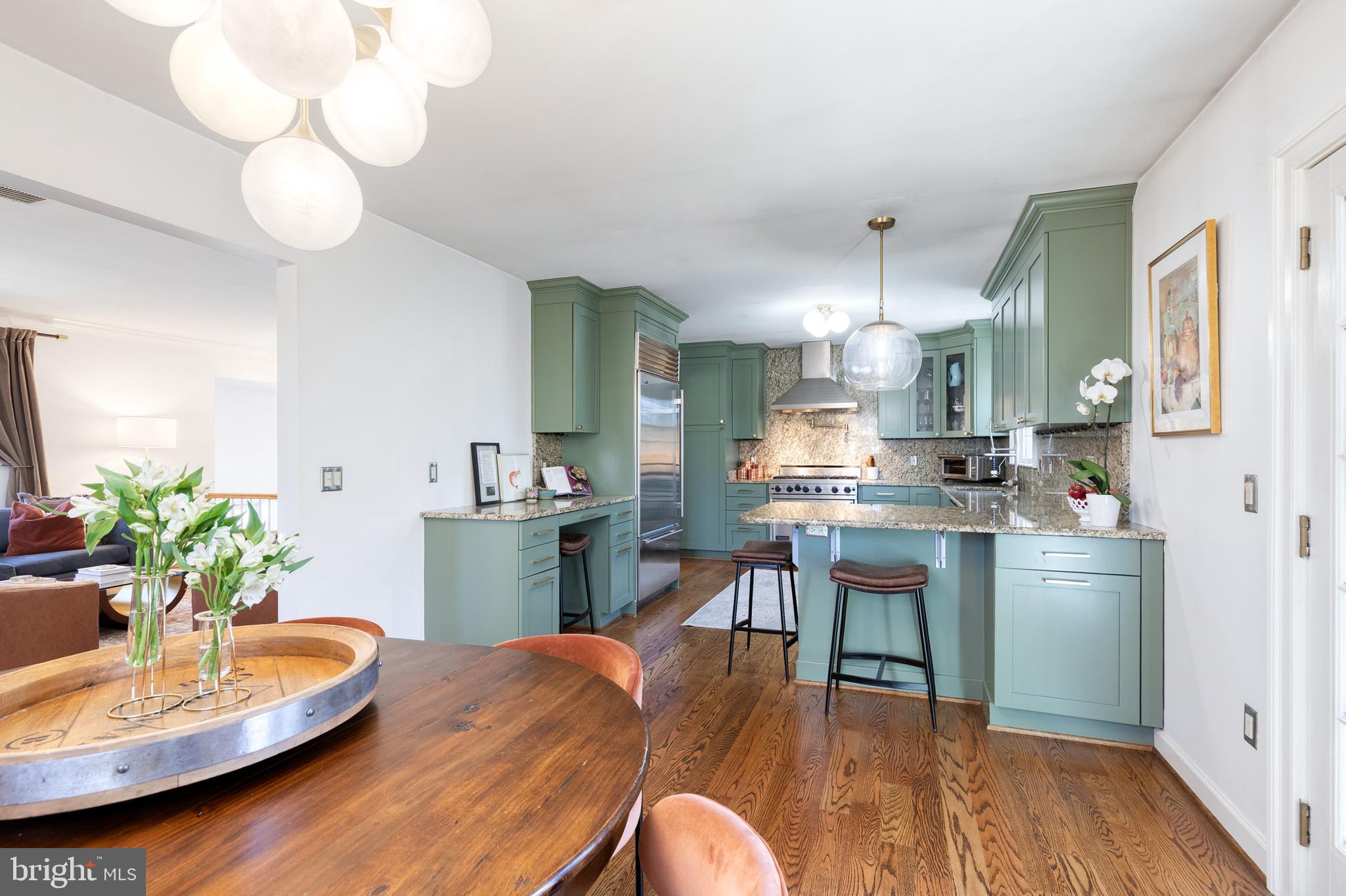 232 Cardamon Drive Edgewater, MD 21037 - Photo 11 of 44 a kitchen with a table and chairs