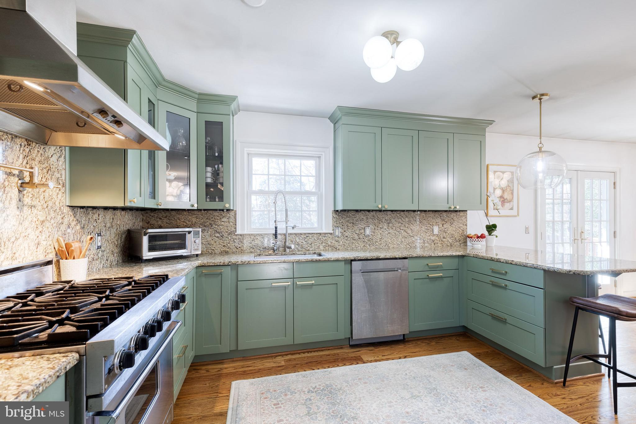 232 Cardamon Drive Edgewater, MD 21037 - Photo 13 of 44 a kitchen with a sink and a stove top oven