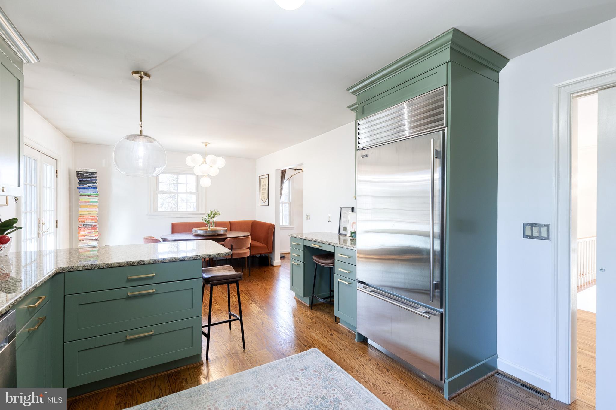 232 Cardamon Drive Edgewater, MD 21037 - Photo 14 of 44 a kitchen with kitchen island a counter top space a sink stainless steel appliances and cabinets