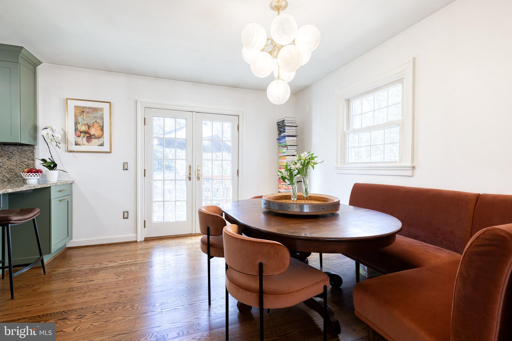 232 Cardamon Drive Edgewater, MD 21037 - Photo 16 of 44 a view of a dining room with furniture window and wooden floor