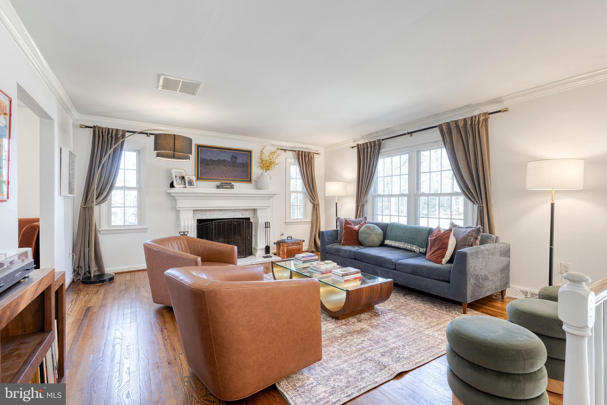 232 Cardamon Drive Edgewater, MD 21037 - Photo 2 of 44 a living room with furniture a fireplace and a large window