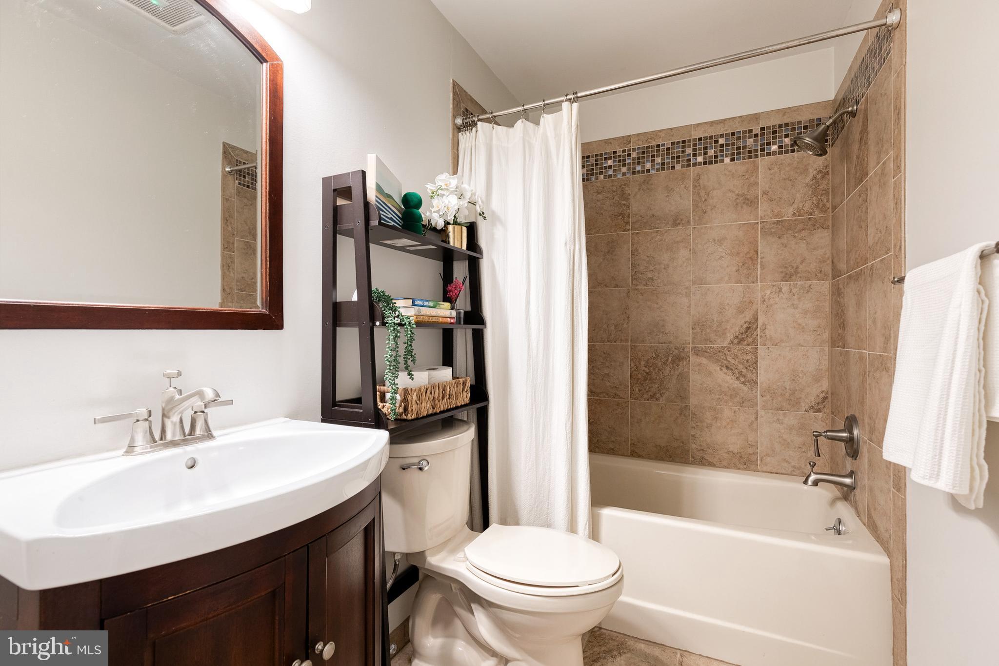 232 Cardamon Drive Edgewater, MD 21037 - Photo 21 of 44 a bathroom with a sink toilet and shower
