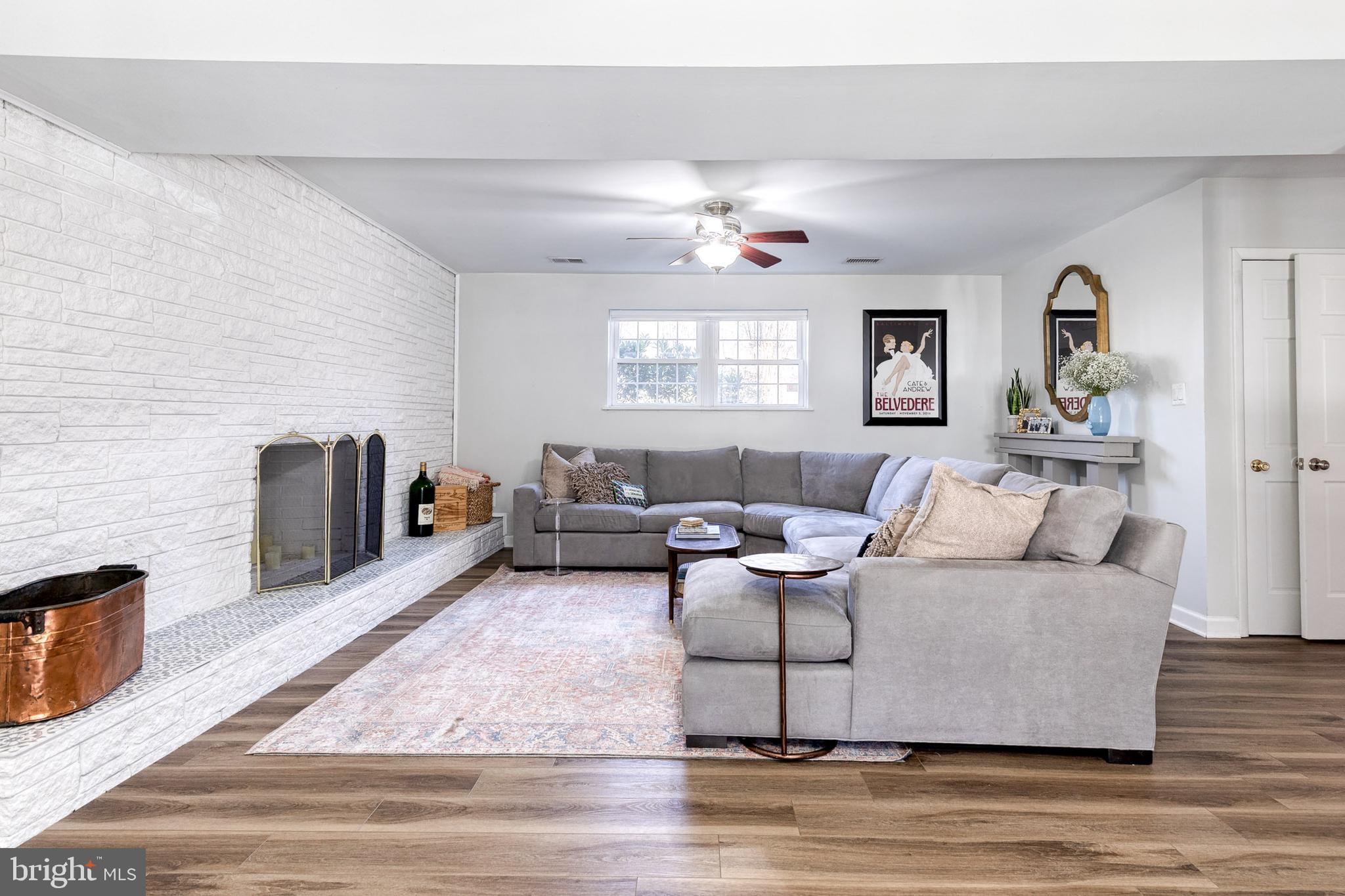 232 Cardamon Drive Edgewater, MD 21037 - Photo 22 of 44 a living room with furniture and a flat screen tv