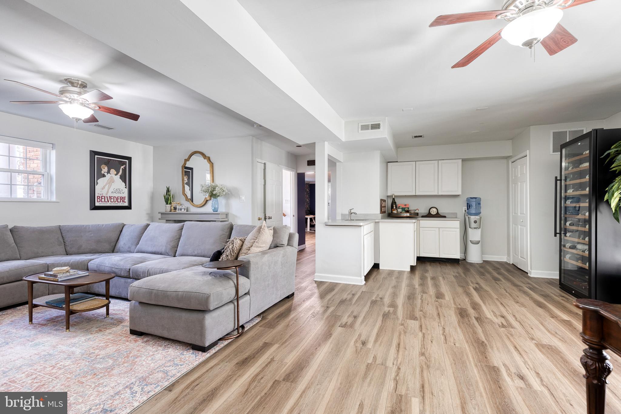 232 Cardamon Drive Edgewater, MD 21037 - Photo 24 of 44 a living room with furniture and a kitchen view
