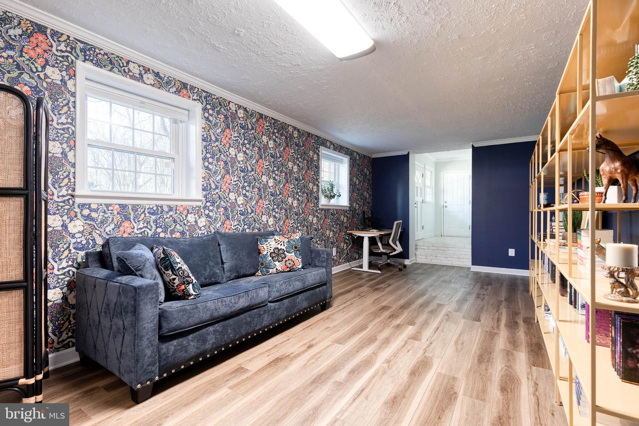 232 Cardamon Drive Edgewater, MD 21037 - Photo 27 of 44 a living room with furniture and a fireplace