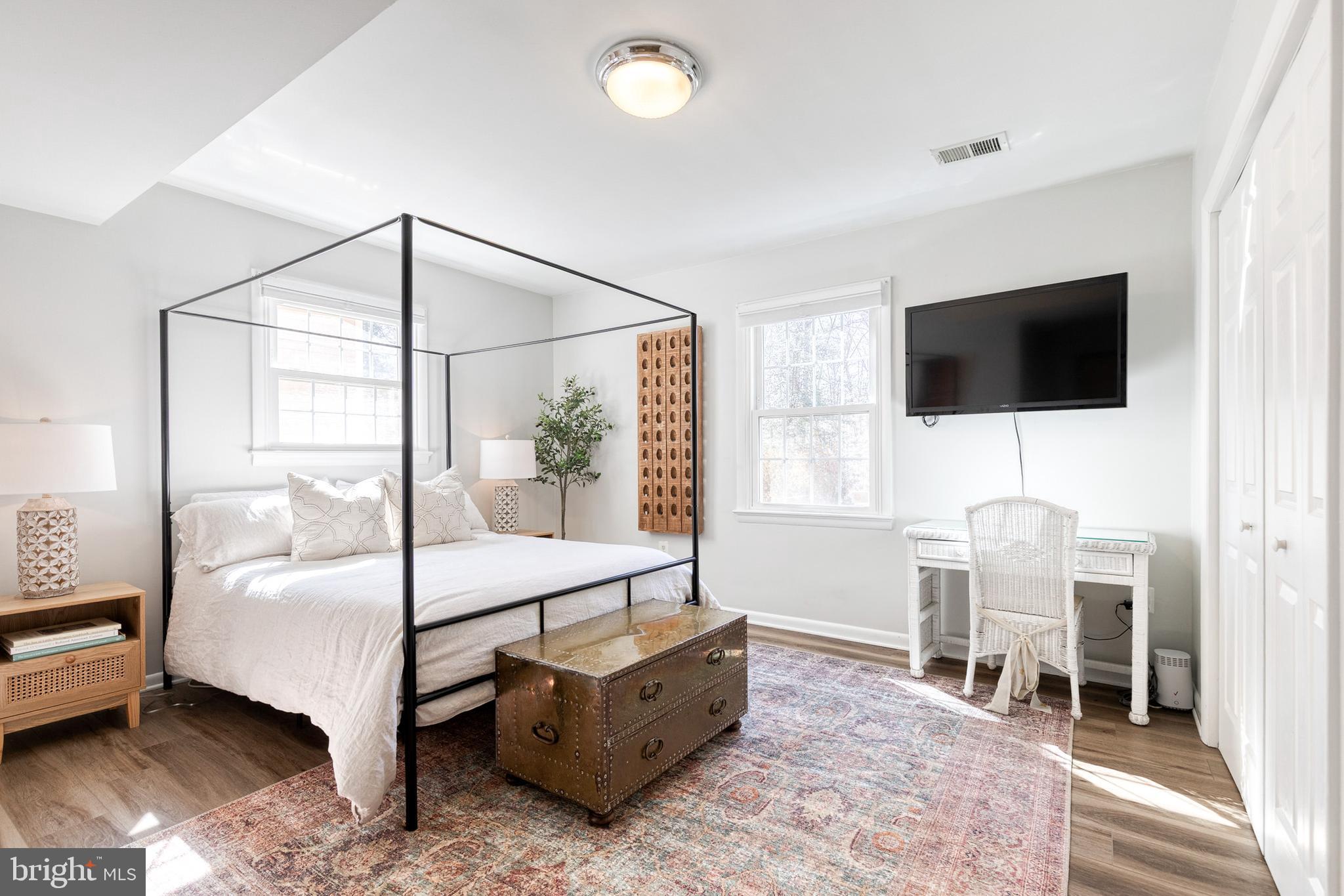 232 Cardamon Drive Edgewater, MD 21037 - Photo 31 of 44 a bedroom with a bed and a flat screen tv