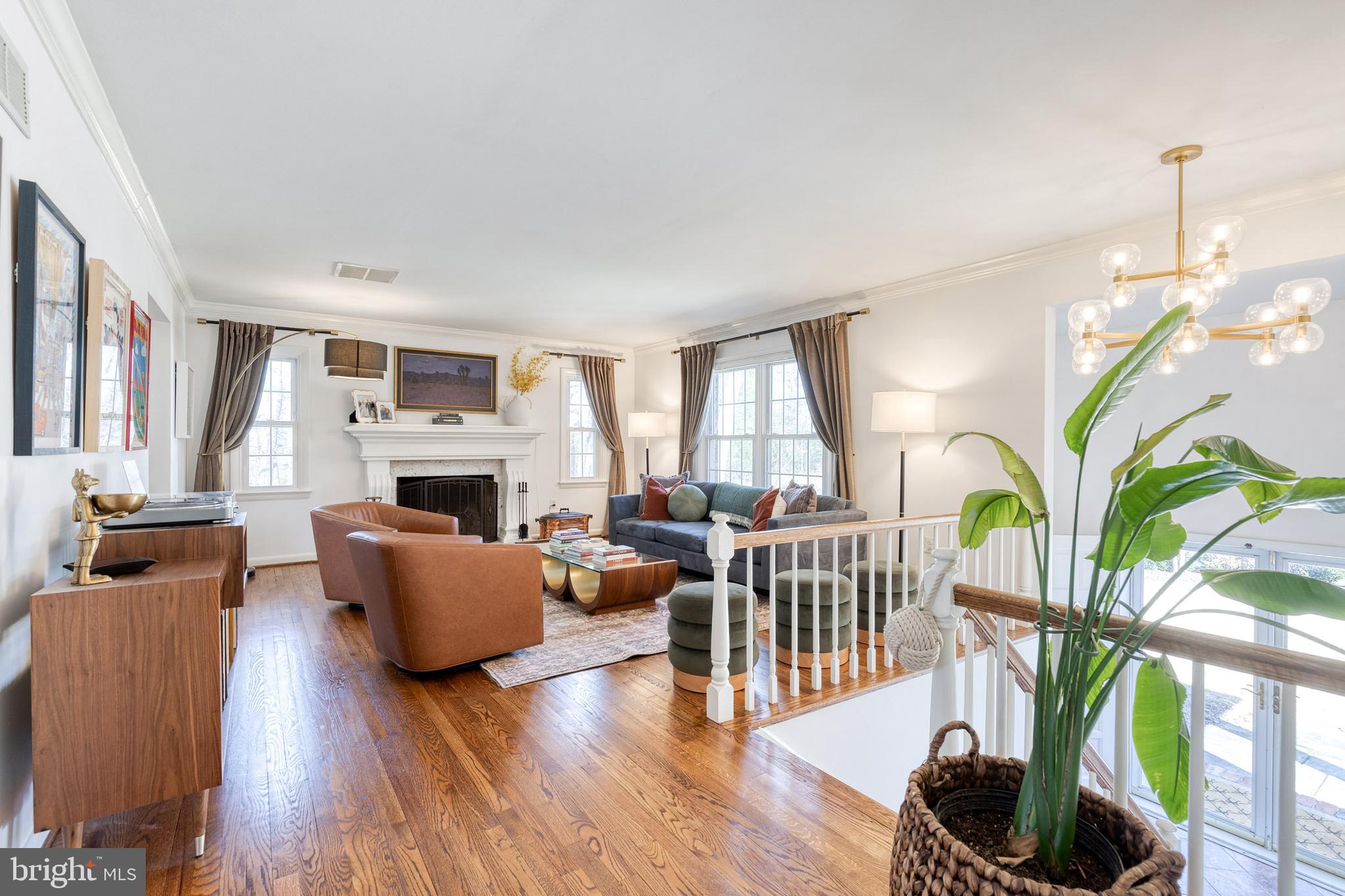 232 Cardamon Drive Edgewater, MD 21037 - Photo 7 of 44 a living room with furniture a fireplace and a potted plant