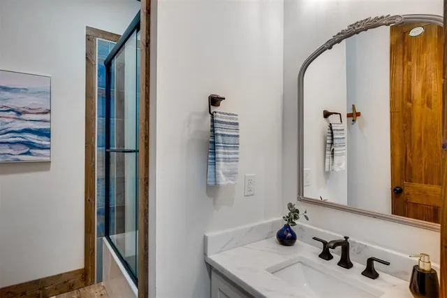 a bathroom with a sink and a mirror