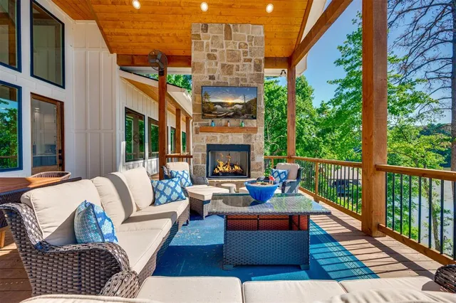 a outdoor living space with patio furniture and a fireplace