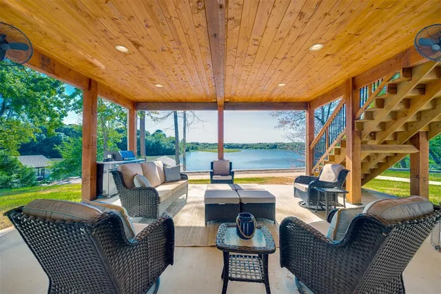 a outdoor living space with patio furniture and garden view