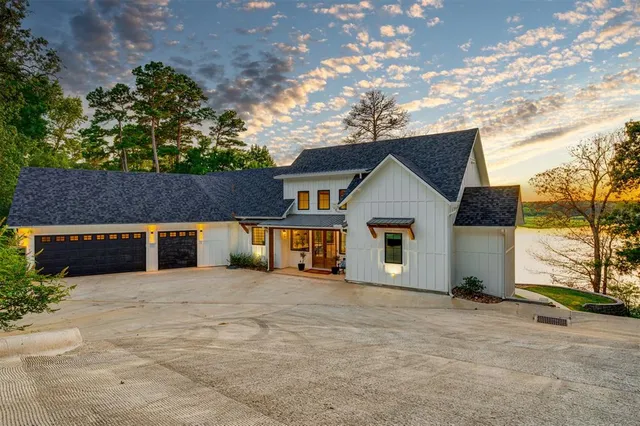 a view of a house with wooden fence