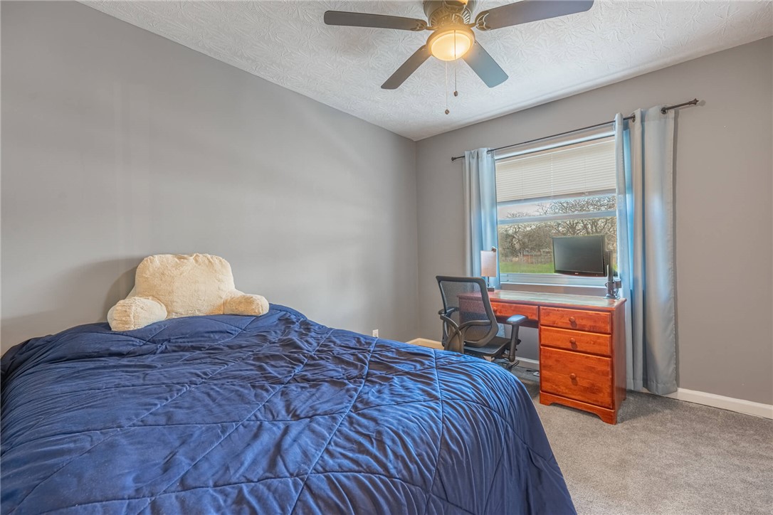 436 Marjorie Avenue Riverside, OH 45404 - Photo 12 of 34 This cozy bedroom features a window for natural light and a ceiling fan for comfort.