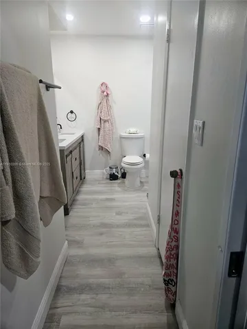 a bathroom with a shower and toilet