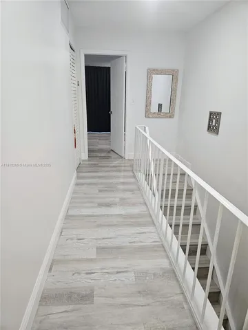 a bed room with a bed and a chair