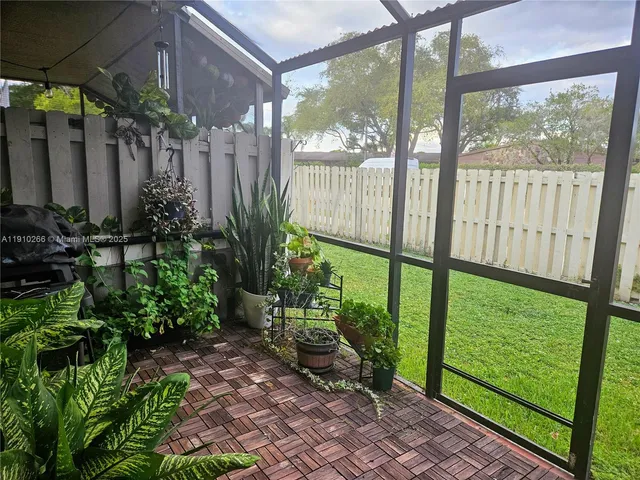 a view of balcony with wooden floor and outdoor space