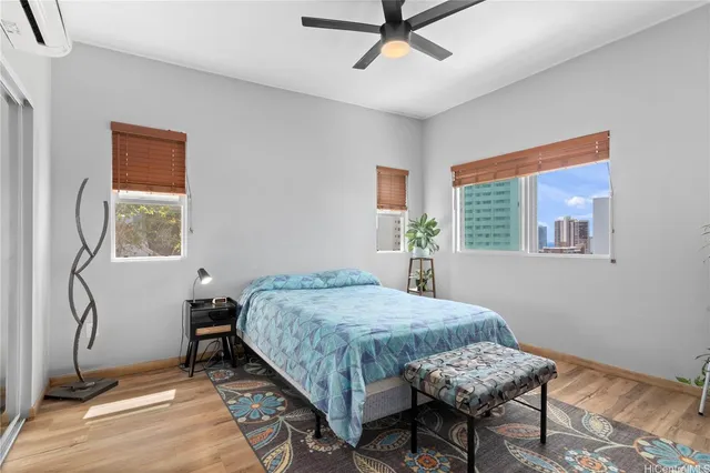 a bedroom with a bed window and a table