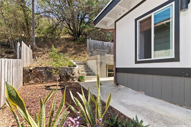 a view of room with wooden floor