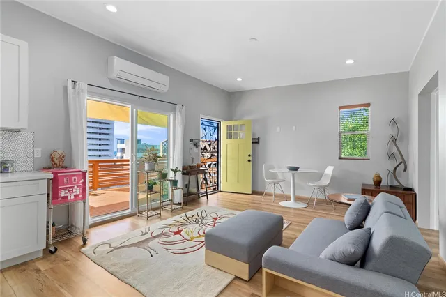 a living room with furniture and a large window