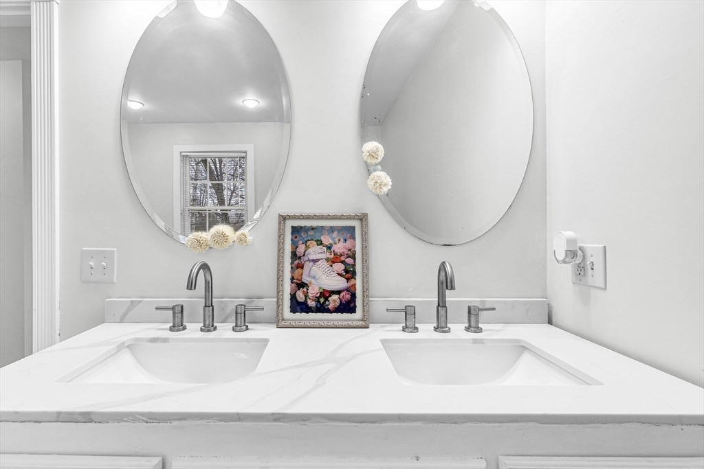 63 South Cottage Road Holland, MA 01521 - Photo 23 of 35 a bathroom with double vanity sinks and a mirror