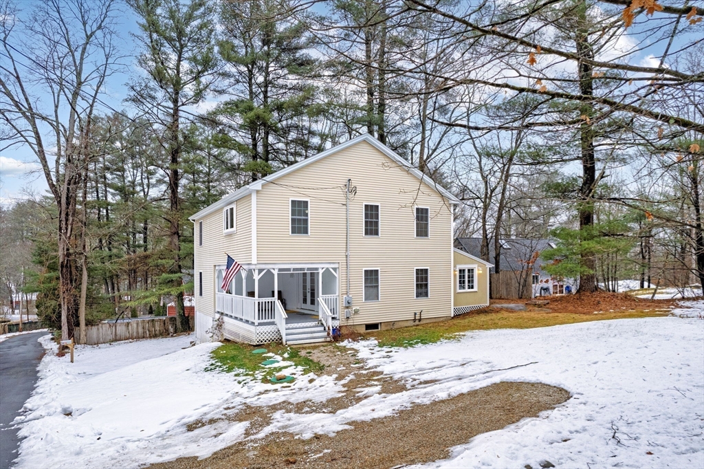 63 South Cottage Road Holland, MA 01521 - Photo 27 of 35 a view of a white house with a large tree