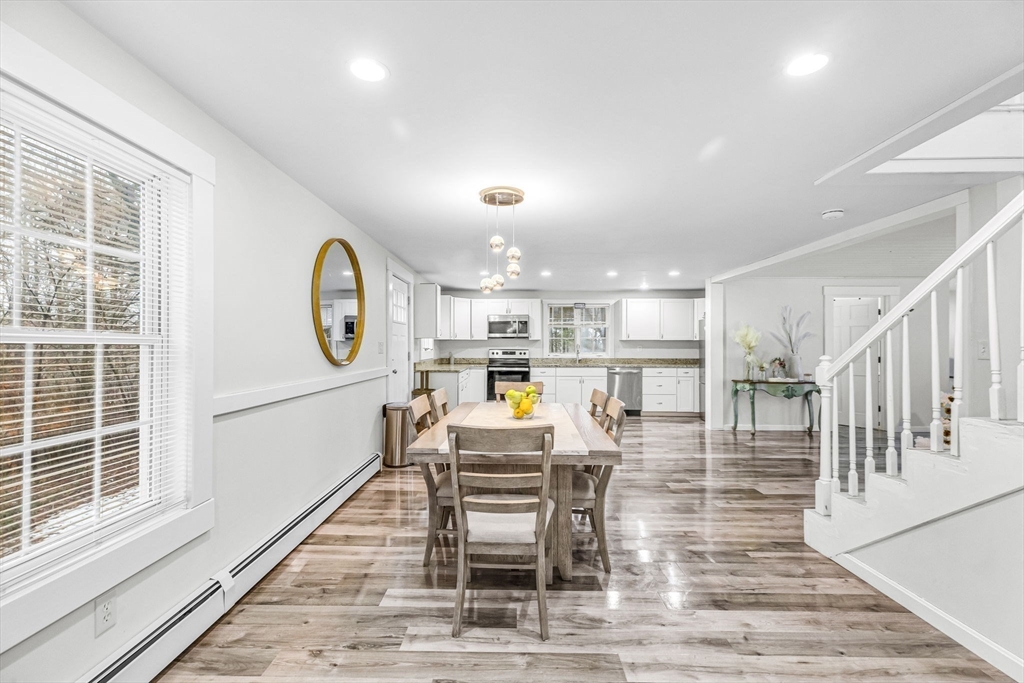 63 South Cottage Road Holland, MA 01521 - Photo 10 of 35 a dining room with wooden floor and a rug
