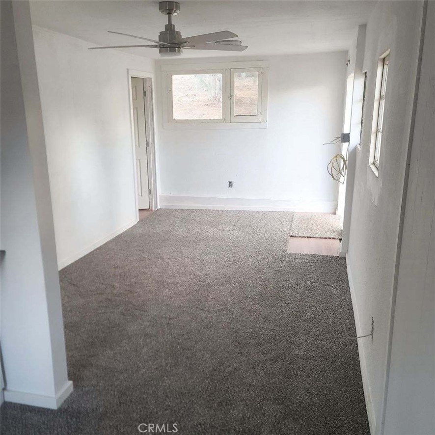 10560 Robinson Avenue Riverside, CA 92505 - Photo 5 of 11 an empty room with windows