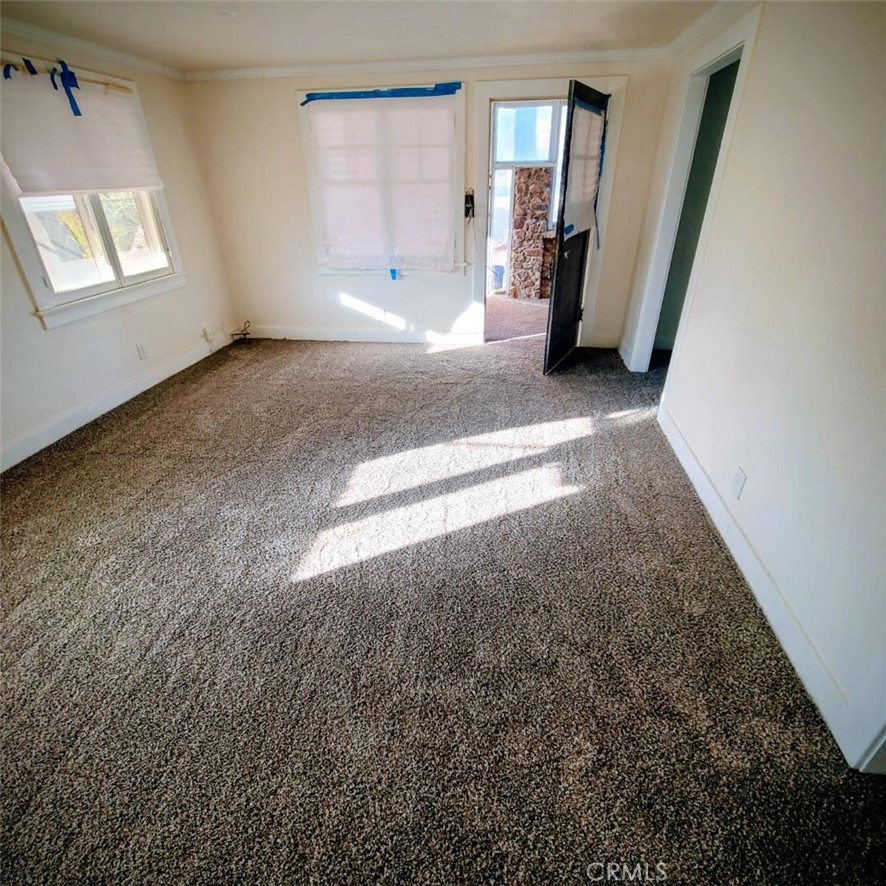 10560 Robinson Avenue Riverside, CA 92505 - Photo 6 of 11 wooden floor in an empty room with a window