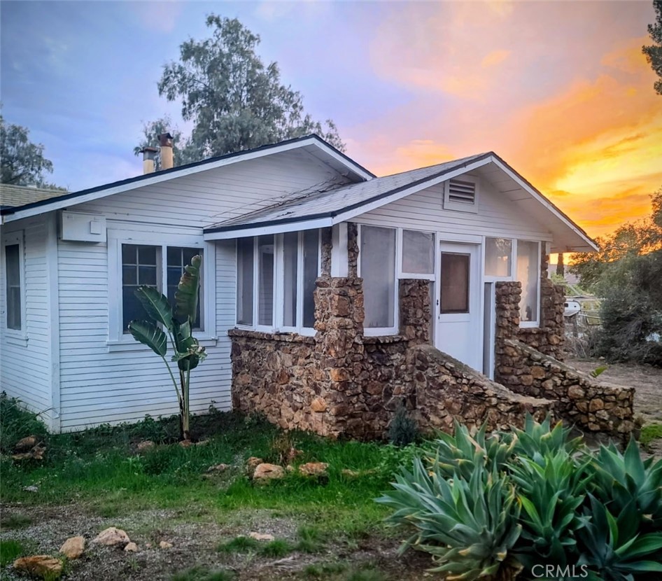 10560 Robinson Avenue Riverside, CA 92505 - Photo 10 of 11 a view of a house with a yard and plants