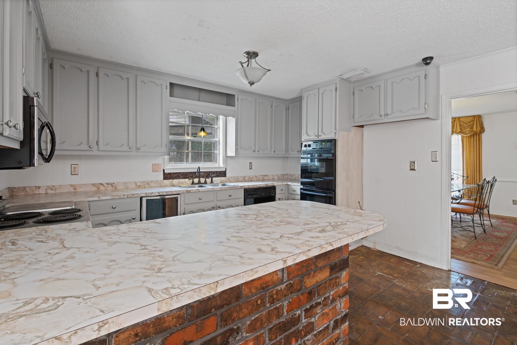 6261 Old Pascagoula Road Theodore, AL 36582 - Photo 18 of 29 Kitchen featuring sink, wine cooler, a textured ceiling, and black appliances