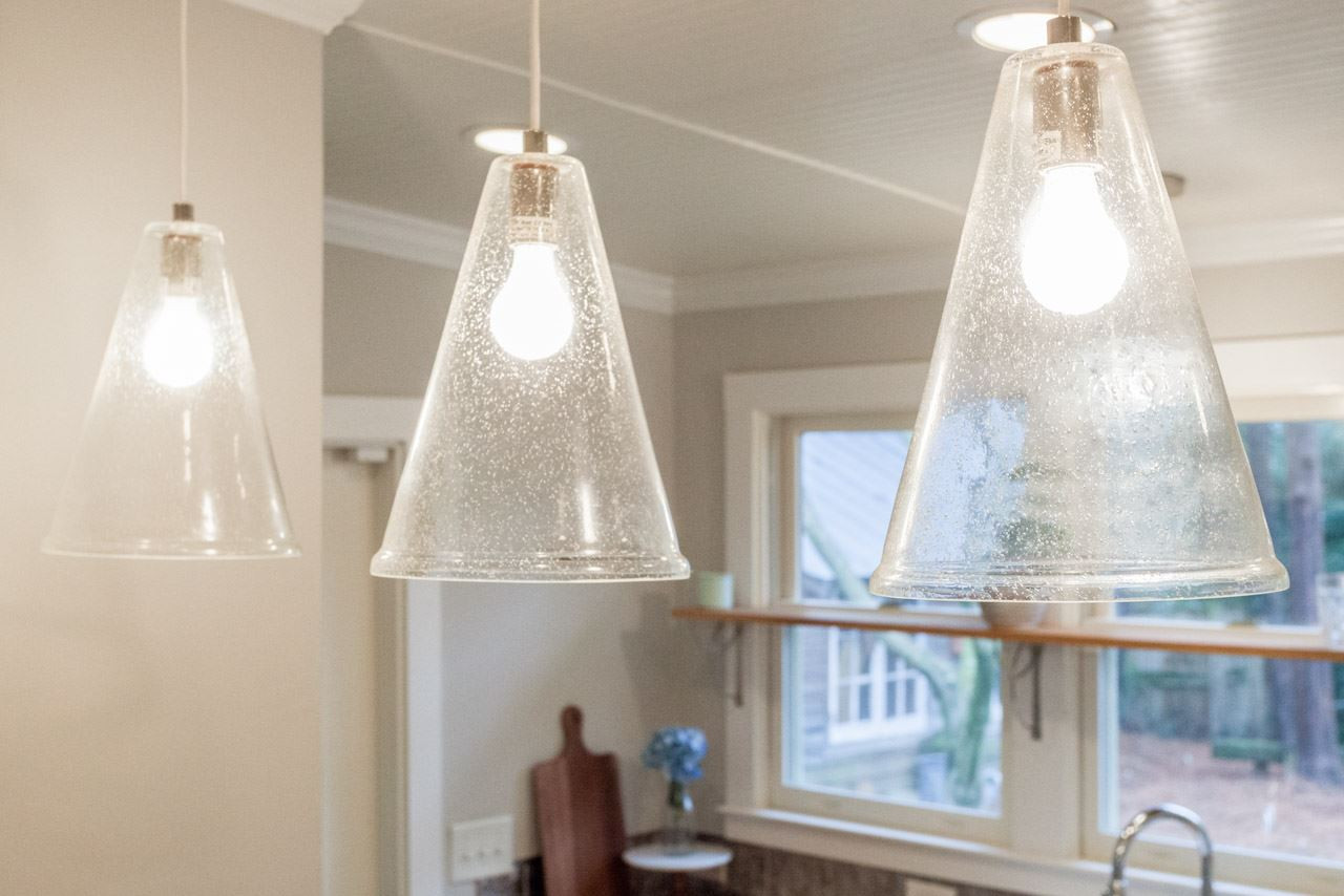 414 Frank Street Raleigh, NC 27604 - Photo 9 of 23 ...and large and bright glass pendants hanging over the island.