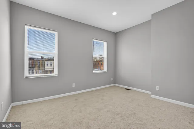 an empty room with windows