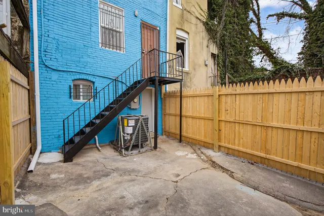 a view of outdoor space with wooden deck and furniture