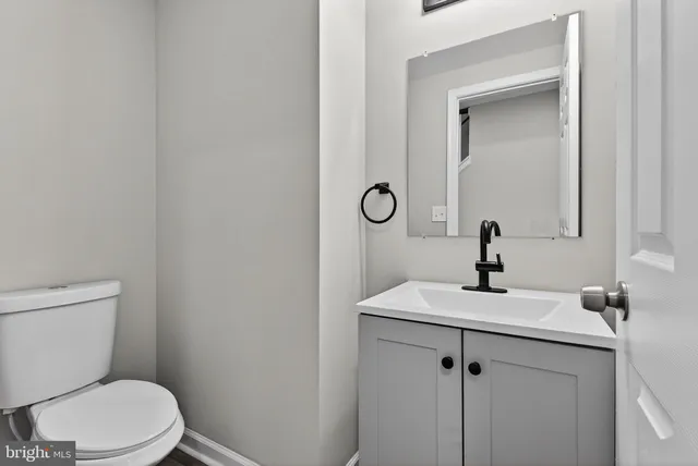 a bathroom with a toilet sink