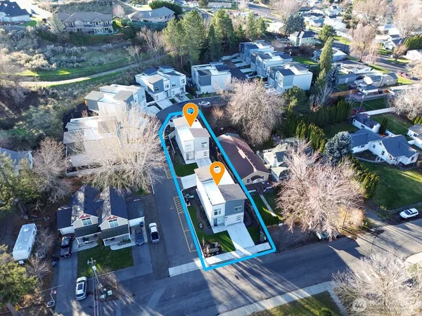 a bird view of houses and swimming pool