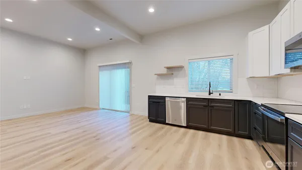 a kitchen with sink and cabinets