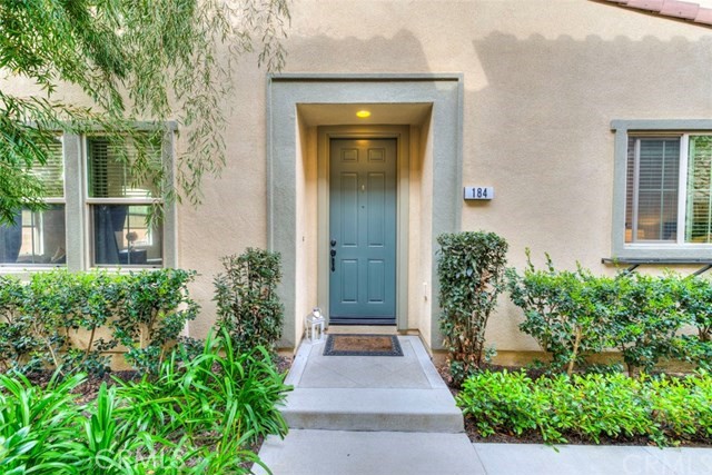 front view of the house with potted plants