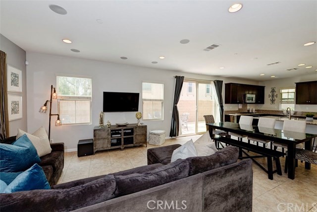 184 Pathway Irvine, CA 92618 - Photo 2 of 7 a living room with kitchen furniture and a flat screen tv
