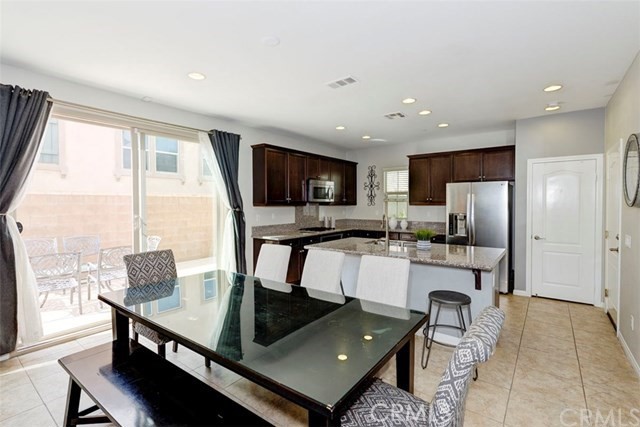 184 Pathway Irvine, CA 92618 - Photo 3 of 7 a kitchen with stainless steel appliances granite countertop a refrigerator and a stove top oven