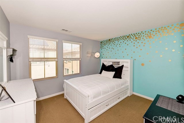 184 Pathway Irvine, CA 92618 - Photo 7 of 7 a bed sitting in a bedroom next to a window