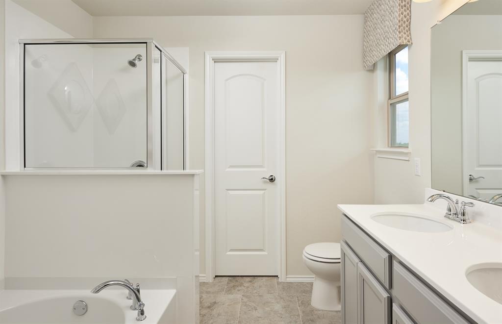 1087 Clear Dusk Lane Forney, TX 75126 - Photo 10 of 12 a bathroom with a granite countertop sink toilet and shower